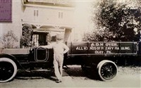 : Amandus D. Moyer and one of the original delivery trucks!